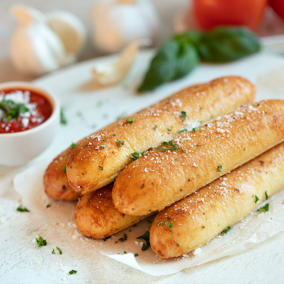breadsticks on a plate, ready to serve