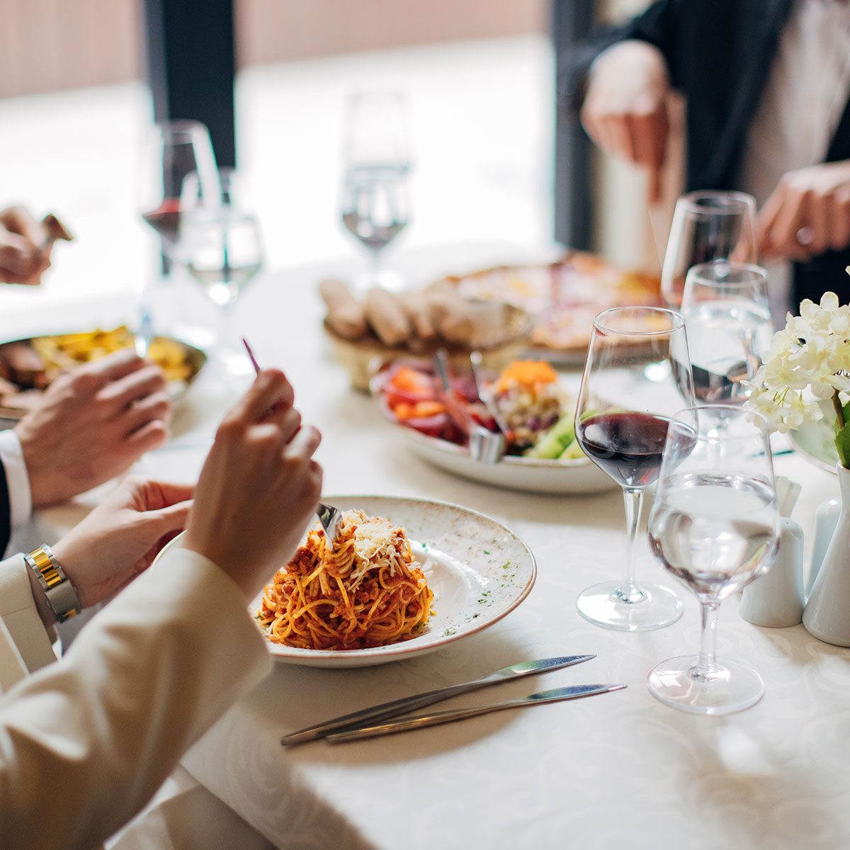Persons eating food in a restaurent