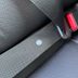 Here's What That Little Button on Your Seat Belt Is For
